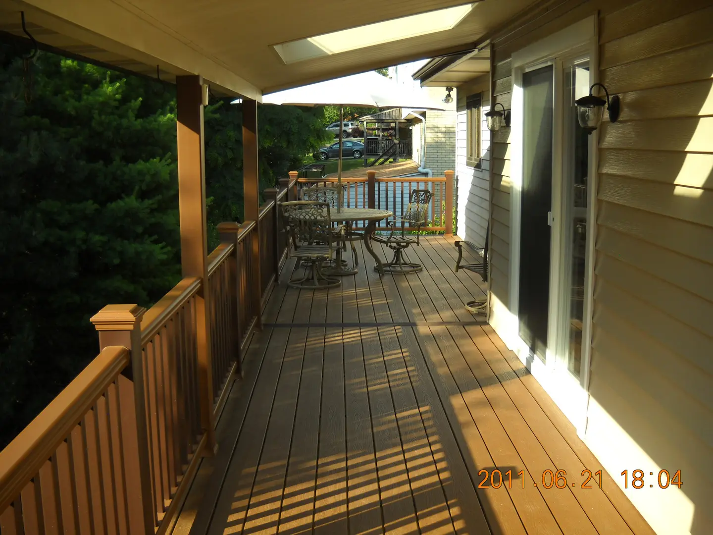 A deck with tables and chairs on it