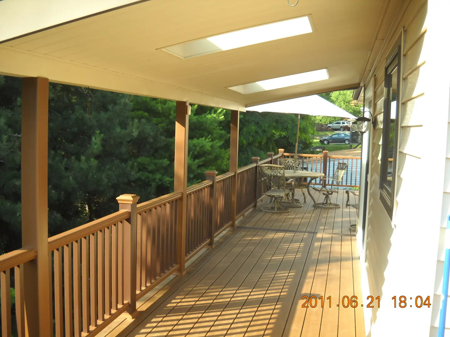 A deck with tables and chairs on it